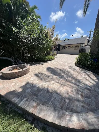 Hardscape contractor serving Brevard County with custom paver driveways, pool decks, patios, walkways, retaining walls, seating walls, outdoor kitchens, fire pits, drainage systems, concrete work, and landscape enhancements.