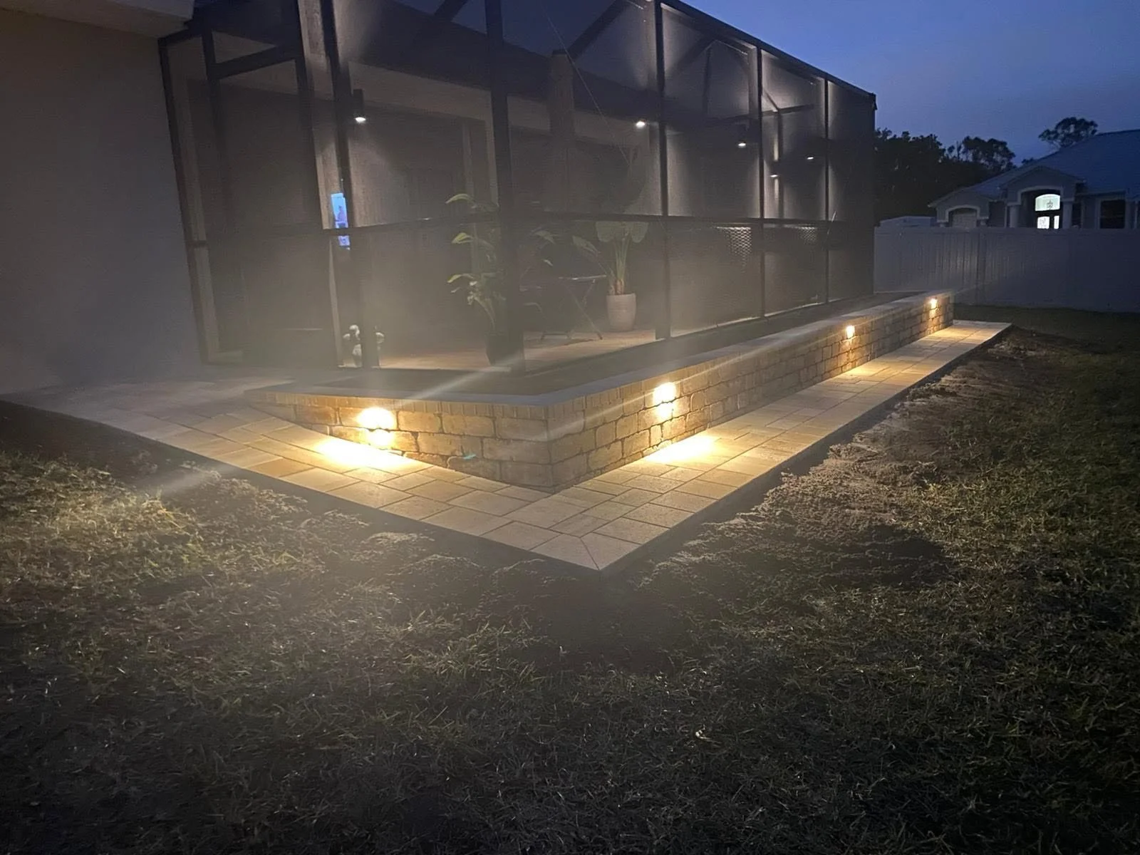 Brevard County paver contractor specializing in paver driveways, patios, pool decks, walkways, retaining walls, outdoor kitchens, fire pits, concrete driveways, concrete patios, drainage correction, decorative rock installation, artificial turf