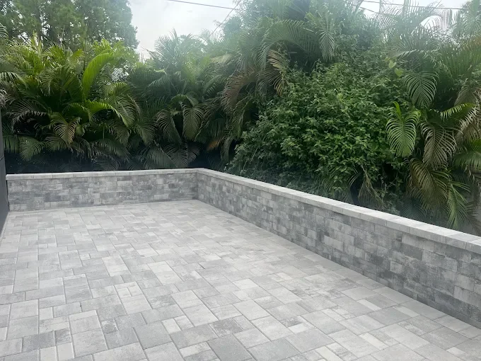 Outdoor living contractor specializing in paver patios, pool decks, outdoor kitchens, fire pits, and retaining walls serving Melbourne, Palm Bay, and surrounding Florida communities.