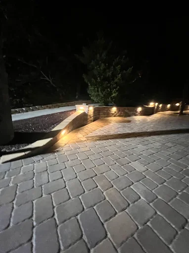 Hardscape contractor serving Brevard County with custom paver driveways, pool decks, patios, walkways, retaining walls, seating walls, outdoor kitchens, fire pits, drainage systems, concrete work, and landscape enhancements.