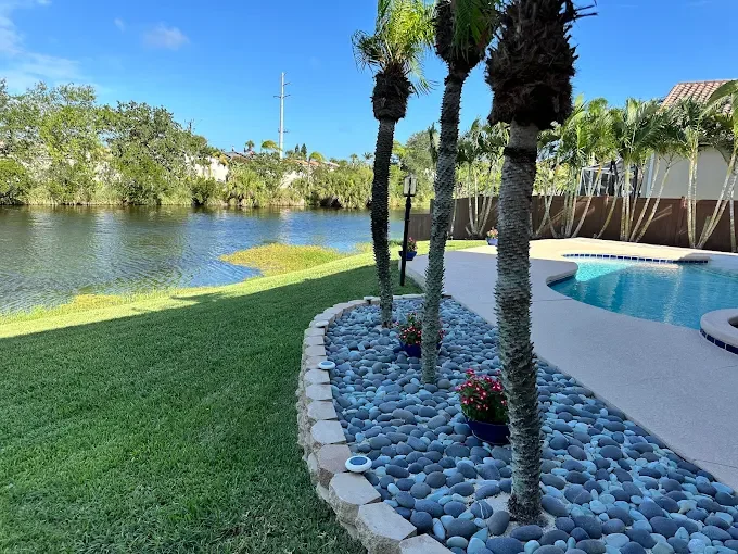 Luxury outdoor living, paver installation, concrete construction, artificial turf, retaining wall, drainage, and landscape design projects completed by Imperium Pavers across Melbourne, Palm Bay, Viera, Suntree, and surrounding Florida communities.