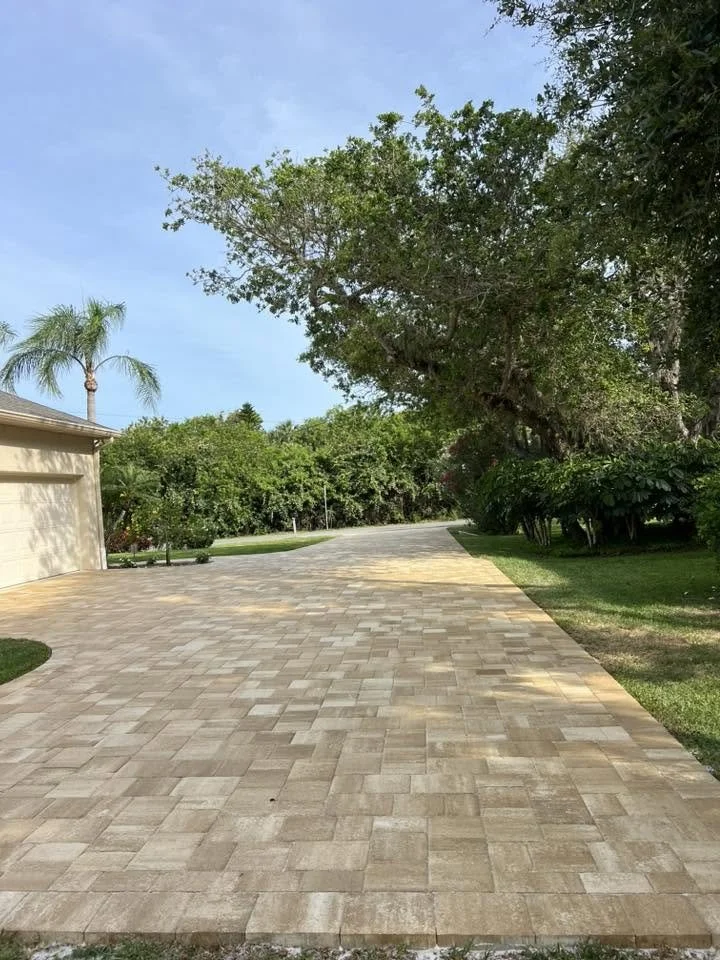 Brevard County paver contractor specializing in paver driveways, patios, pool decks, walkways, retaining walls, outdoor kitchens, fire pits, concrete driveways, concrete patios, drainage correction, decorative rock installation, artificial turf