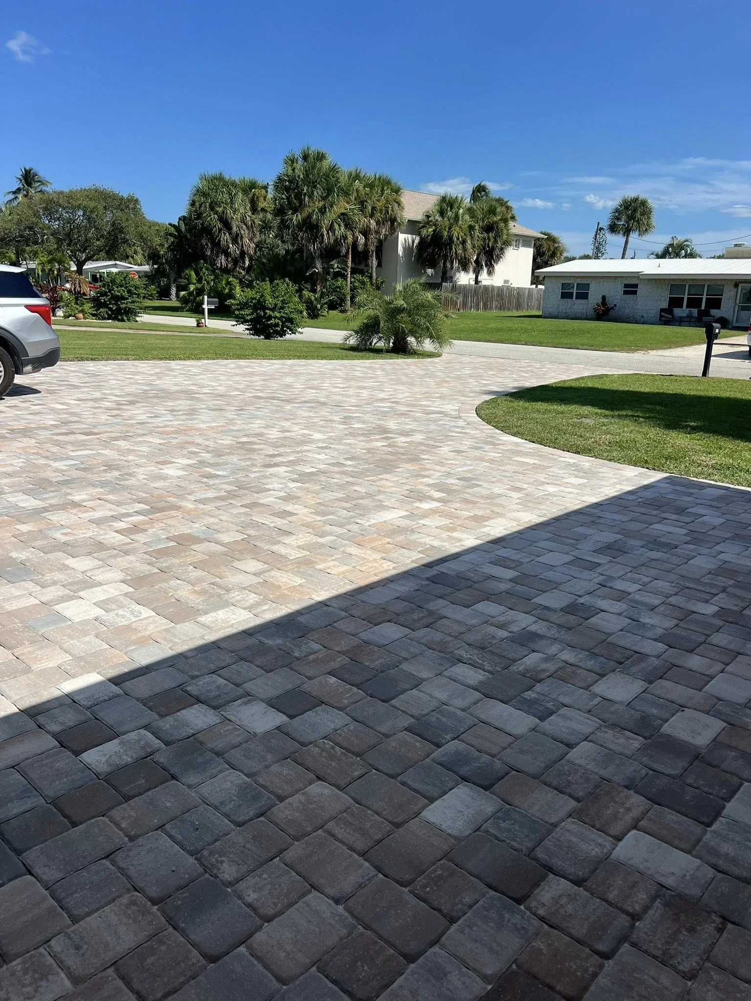 Brevard County paver contractor specializing in paver driveways, patios, pool decks, walkways, retaining walls, outdoor kitchens, fire pits, concrete driveways, concrete patios, drainage correction, decorative rock installation, artificial turf