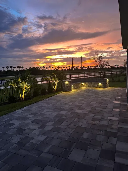 Hardscape contractor serving Brevard County with custom paver driveways, pool decks, patios, walkways, retaining walls, seating walls, outdoor kitchens, fire pits, drainage systems, concrete work, and landscape enhancements.