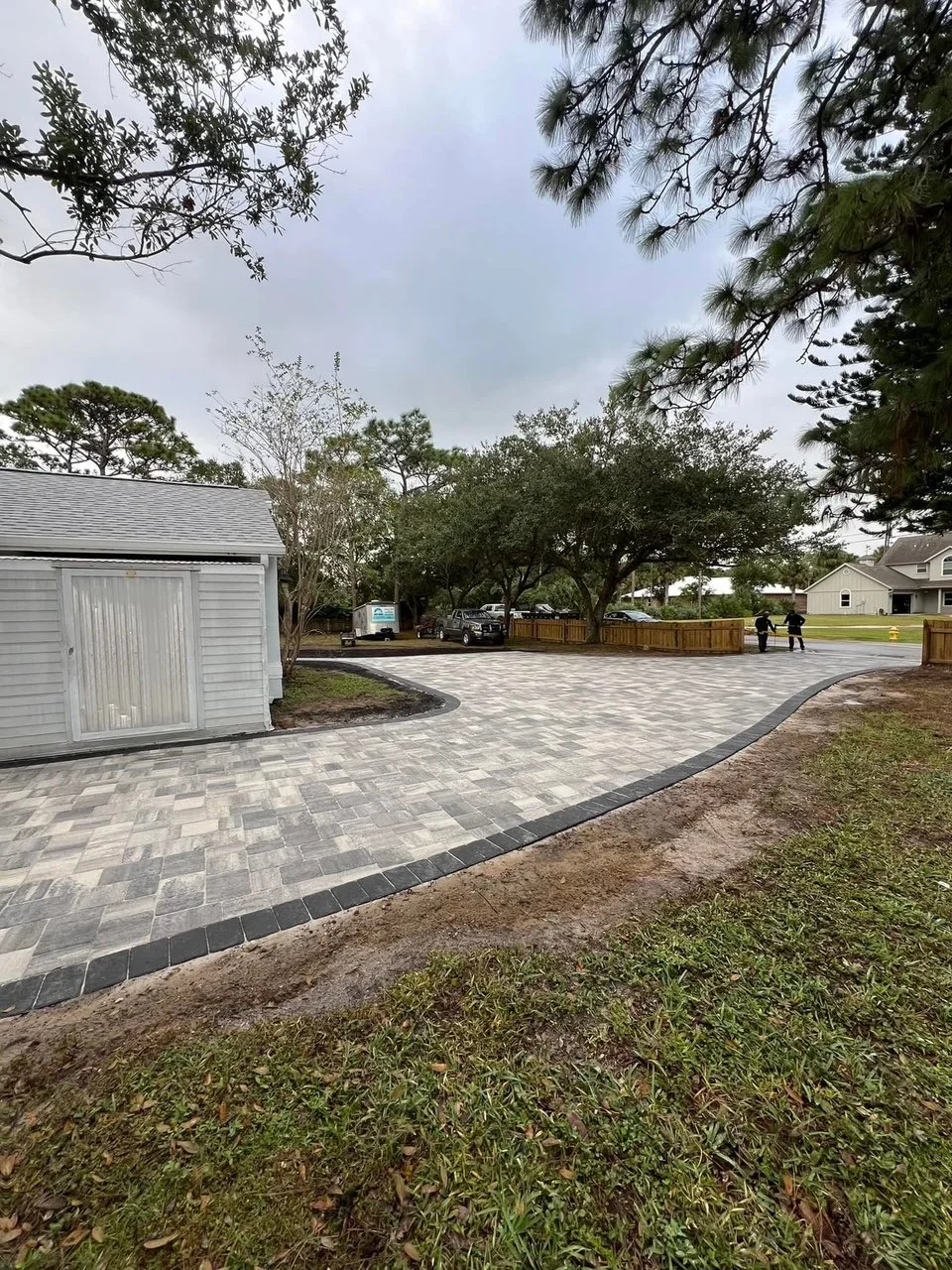 Professional paver installation contractor specializing in driveways, patios, walkways, retaining walls, outdoor kitchens, and fire pits throughout Brevard County, Florida.