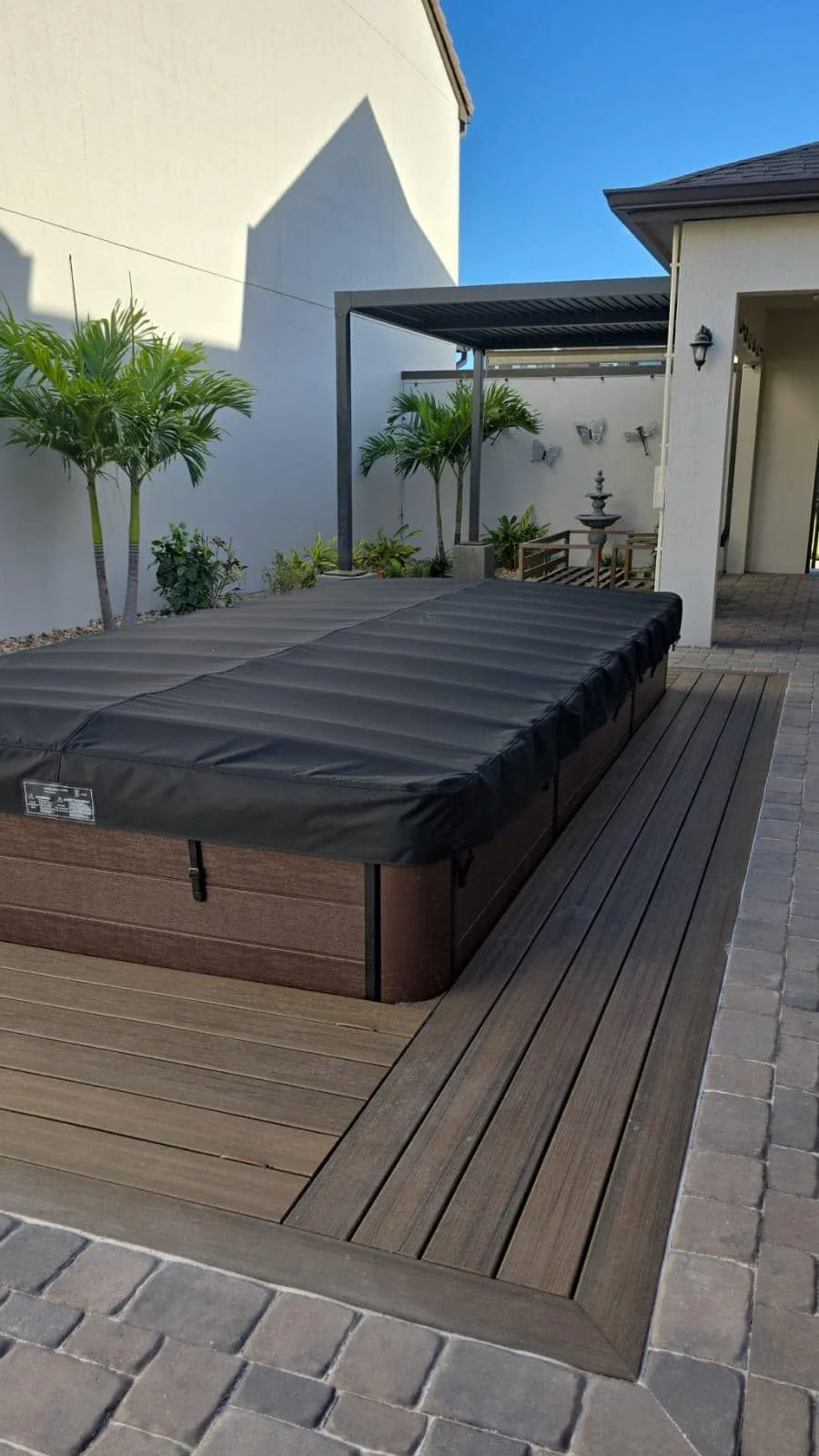 Residential hardscape and outdoor living projects including paver driveways, patios, composite decks, concrete installation, drainage solutions, retaining walls, and artificial turf completed throughout Brevard County, Florida by Imperium Pavers.
