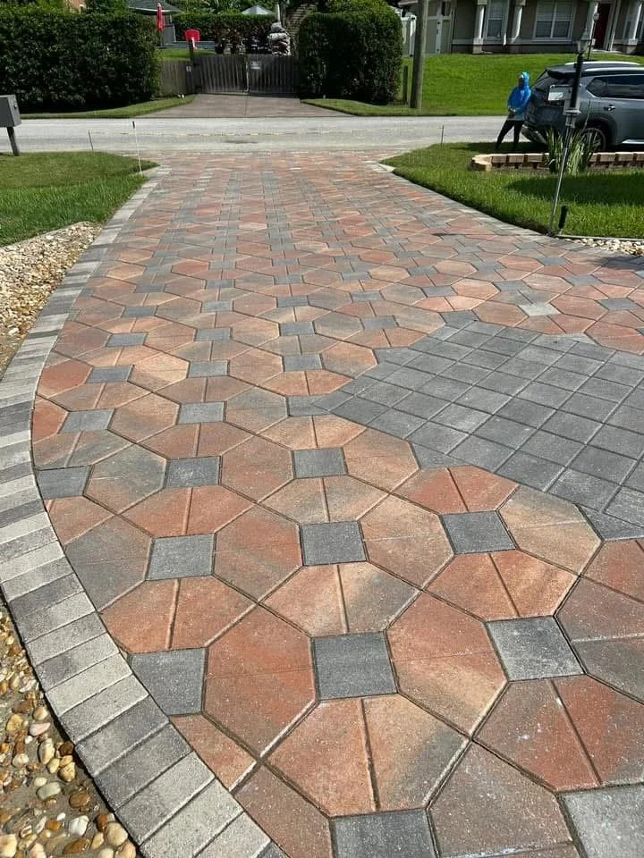 Hardscape contractor serving Brevard County with custom paver driveways, pool decks, patios, walkways, retaining walls, seating walls, outdoor kitchens, fire pits, drainage systems, concrete work, and landscape enhancements.