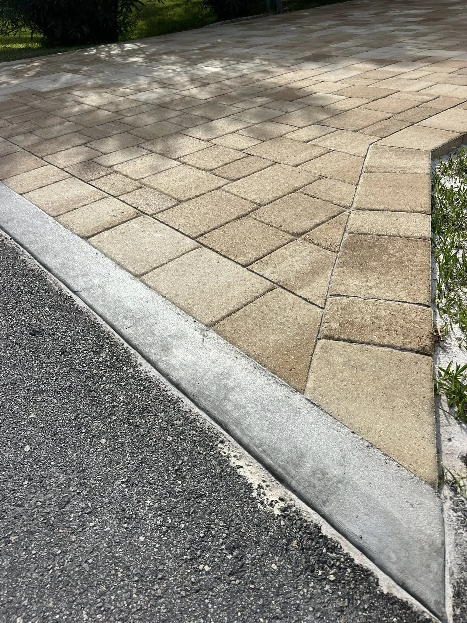 Brevard County paver contractor specializing in paver driveways, patios, pool decks, walkways, retaining walls, outdoor kitchens, fire pits, concrete driveways, concrete patios, drainage correction, decorative rock installation, artificial turf