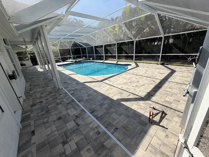 Hardscape contractor serving Brevard County with custom paver driveways, pool decks, patios, walkways, retaining walls, seating walls, outdoor kitchens, fire pits, drainage systems, concrete work, and landscape enhancements.