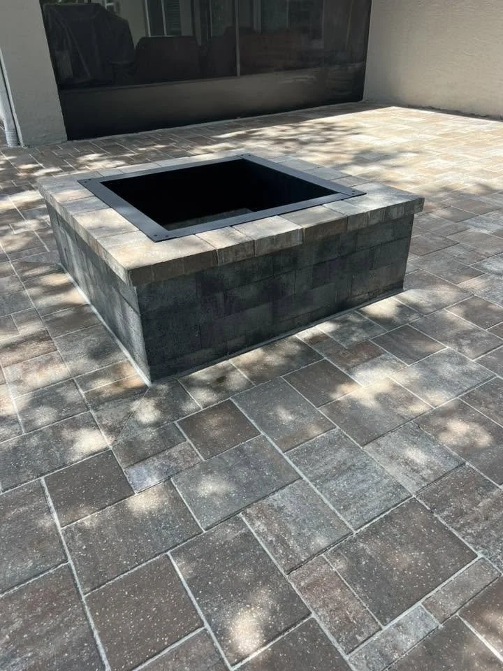 Brevard County paver contractor specializing in paver driveways, patios, pool decks, walkways, retaining walls, outdoor kitchens, fire pits, concrete driveways, concrete patios, drainage correction, decorative rock installation, artificial turf
