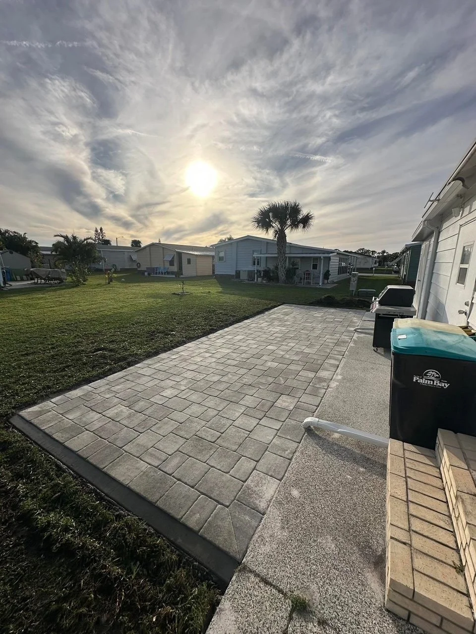 Professional paver installation contractor specializing in driveways, patios, walkways, retaining walls, outdoor kitchens, and fire pits throughout Brevard County, Florida.