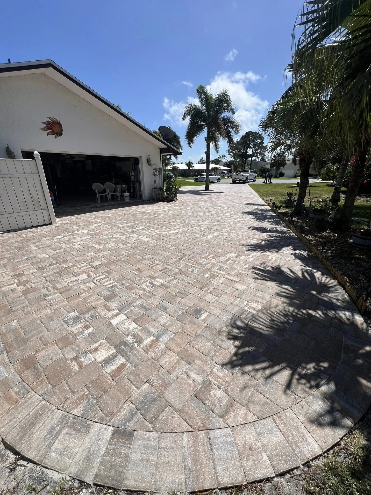 Brevard County paver contractor specializing in paver driveways, patios, pool decks, walkways, retaining walls, outdoor kitchens, fire pits, concrete driveways, concrete patios, drainage correction, decorative rock installation, artificial turf