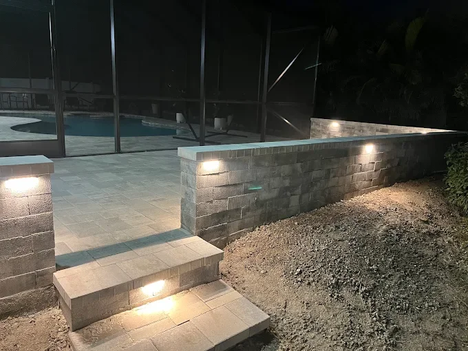 Hardscape contractor serving Brevard County with custom paver driveways, pool decks, patios, walkways, retaining walls, seating walls, outdoor kitchens, fire pits, drainage systems, concrete work, and landscape enhancements.