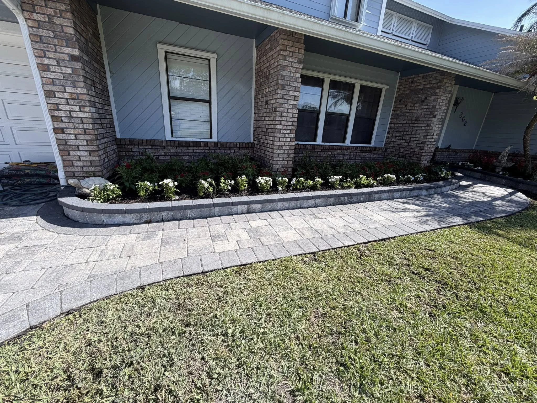 Melbourne and Palm Bay outdoor living contractor providing paver patios, pool decks, driveways, walkways, outdoor kitchens, fire pits, retaining walls, drainage solutions, concrete installation, decorative rock, and artificial turf.