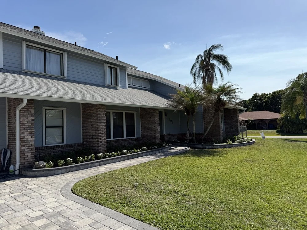 Melbourne and Palm Bay outdoor living contractor providing paver patios, pool decks, driveways, walkways, outdoor kitchens, fire pits, retaining walls, drainage solutions, concrete installation, decorative rock, and artificial turf.