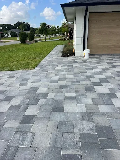 Hardscape contractor serving Brevard County with custom paver driveways, pool decks, patios, walkways, retaining walls, seating walls, outdoor kitchens, fire pits, drainage systems, concrete work, and landscape enhancements.