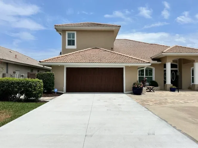 Outdoor living contractor serving Brevard County with paver driveways, patios, pool decks, retaining walls, artificial turf, concrete and drainage services.