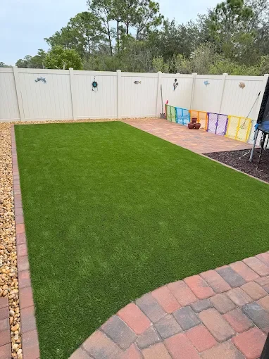 Hardscape contractor serving Brevard County with custom paver driveways, pool decks, patios, walkways, retaining walls, seating walls, outdoor kitchens, fire pits, drainage systems, concrete work, and landscape enhancements.