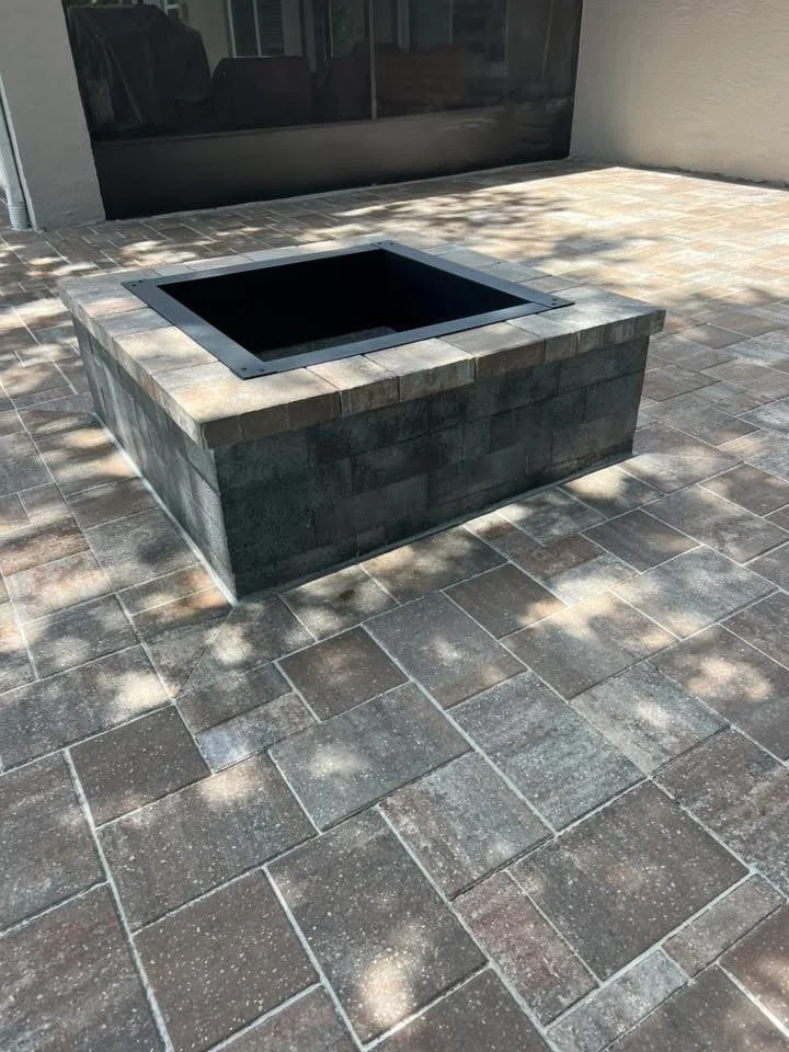 Hardscape contractor serving Brevard County with custom paver driveways, pool decks, patios, walkways, retaining walls, seating walls, outdoor kitchens, fire pits, drainage systems, concrete work, and landscape enhancements.