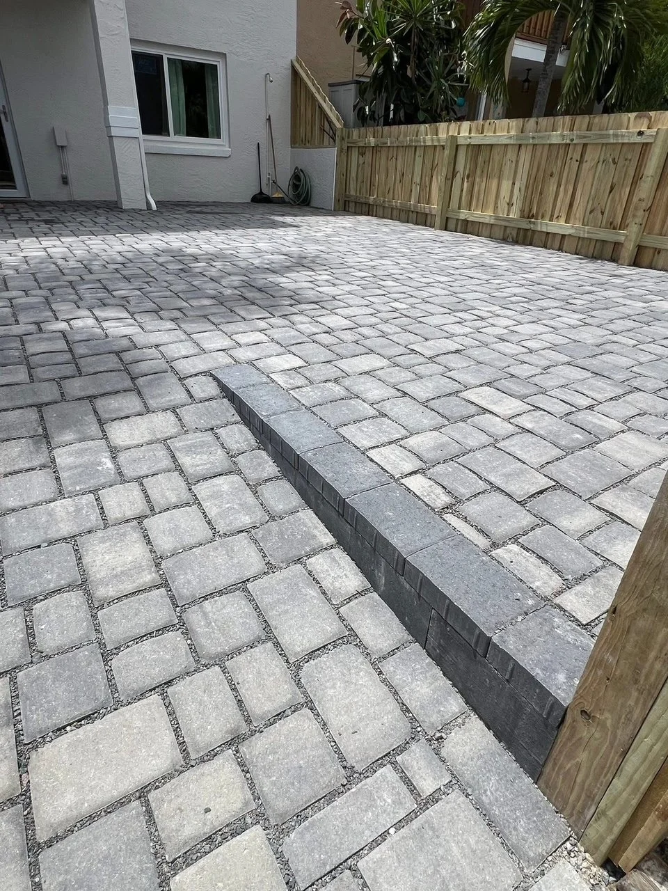 Professional paver installation contractor specializing in driveways, patios, walkways, retaining walls, outdoor kitchens, and fire pits throughout Brevard County, Florida.