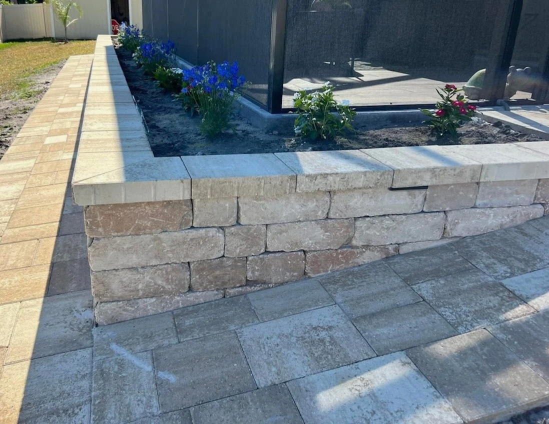 Custom outdoor living, paver installation, concrete, drainage, retaining wall, artificial turf, and landscape projects completed by Imperium Pavers serving Melbourne, Palm Bay, Viera, Suntree, Rockledge, Merritt Island, Satellite Beach, Melbourne Bea