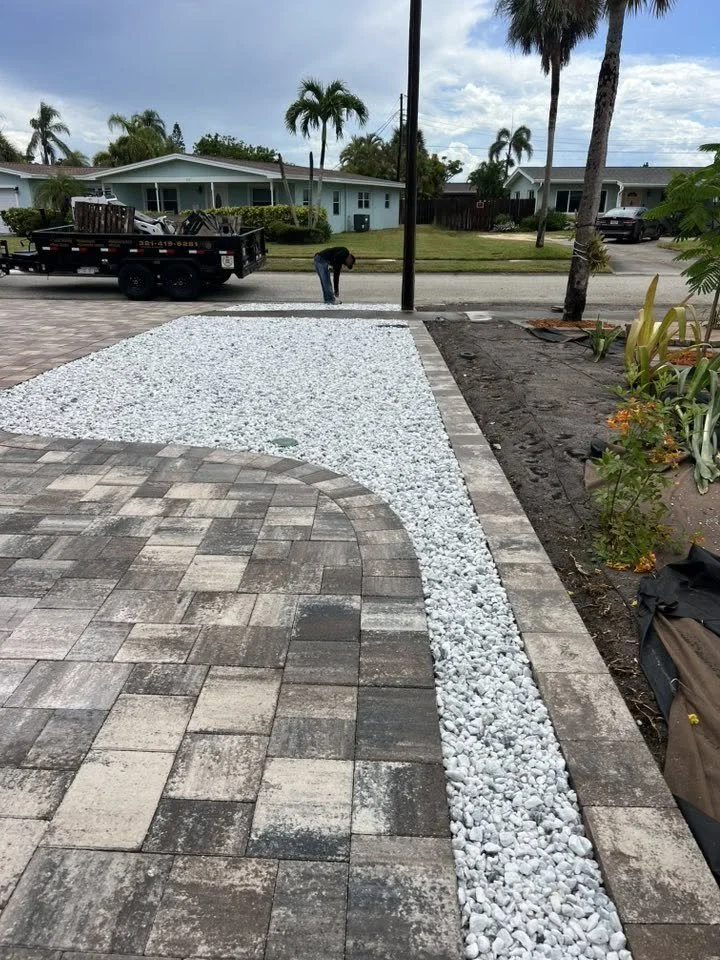 Brevard County paver contractor specializing in paver driveways, patios, pool decks, walkways, retaining walls, outdoor kitchens, fire pits, concrete driveways, concrete patios, drainage correction, decorative rock installation, artificial turf