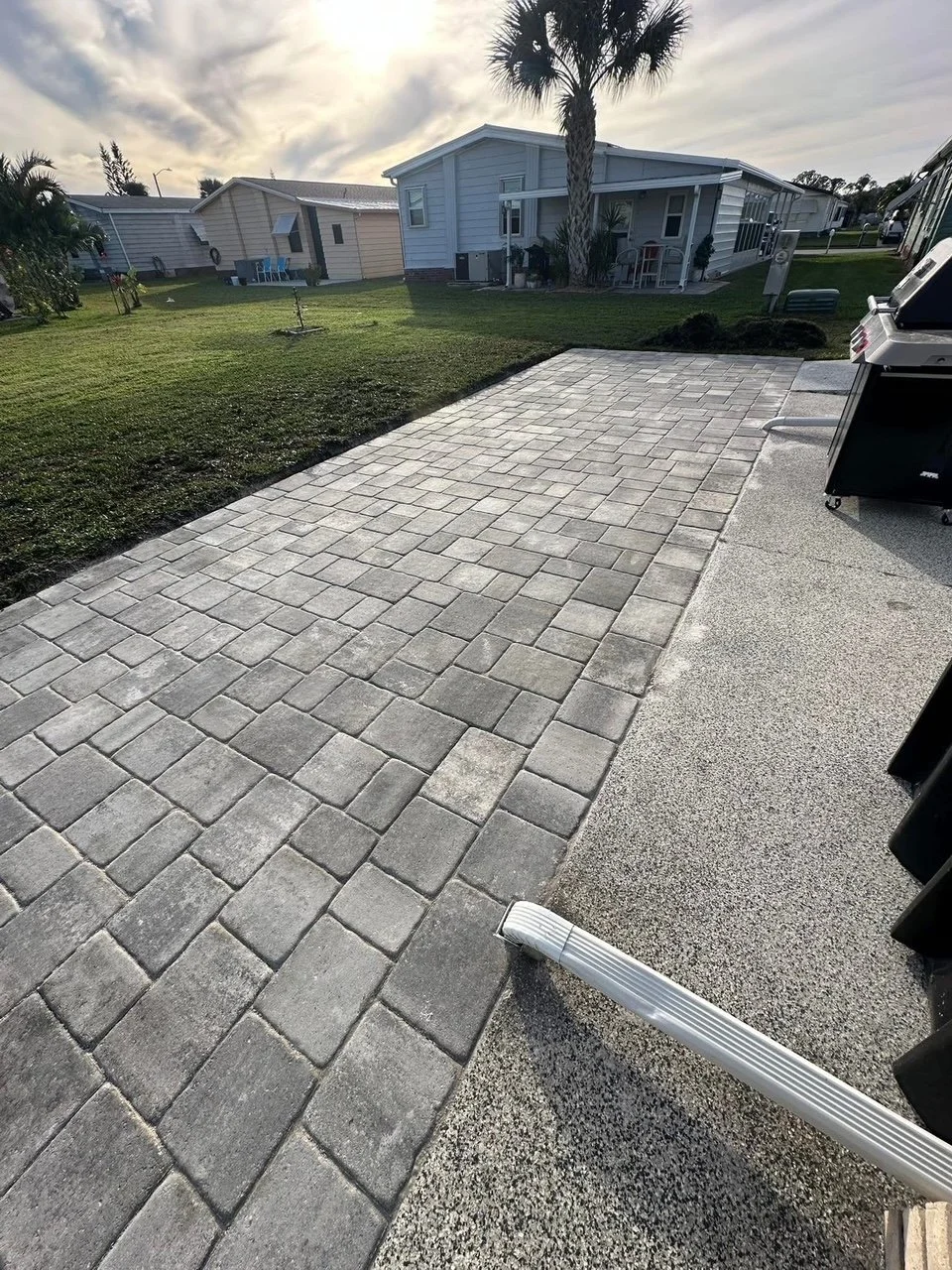 Custom paver driveway, patio, pool deck, and outdoor living installation completed by Imperium Pavers serving Melbourne, Palm Bay, Viera, Rockledge, Merritt Island, and Brevard County, Florida.