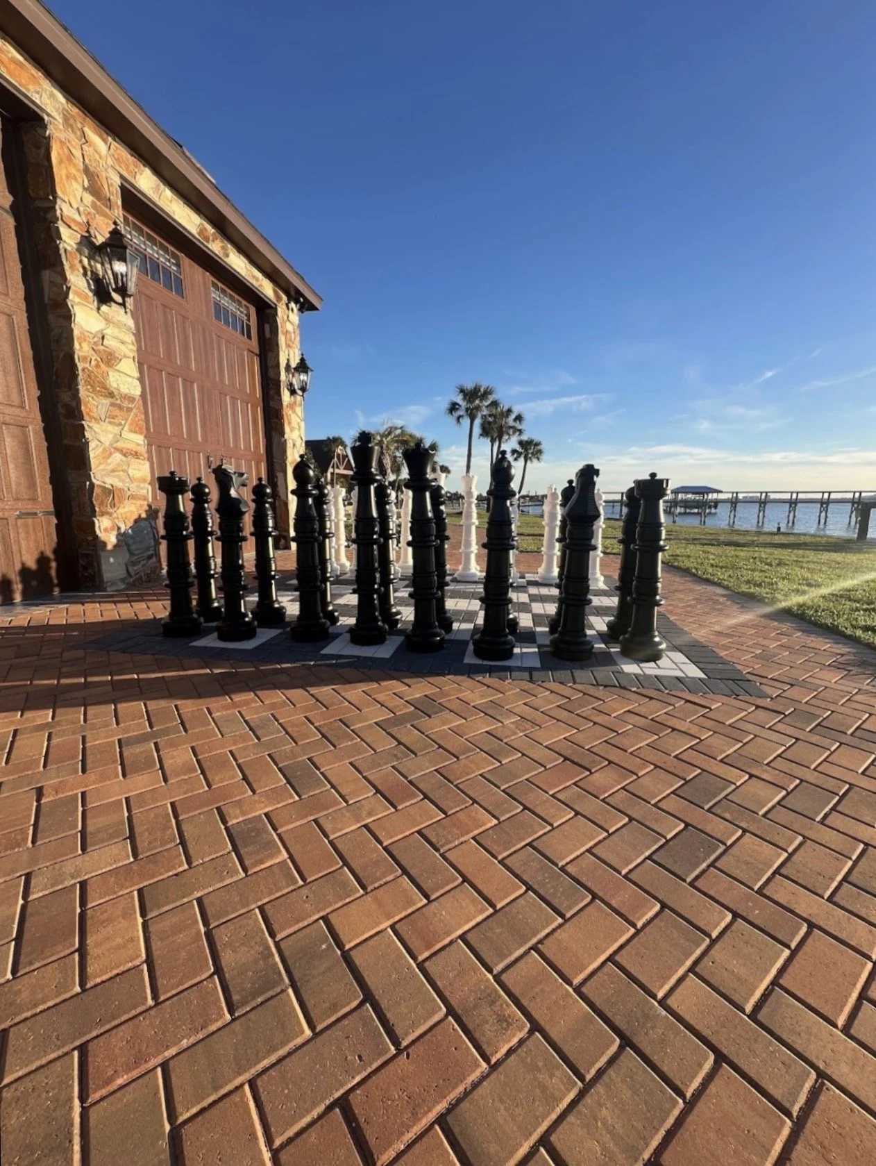 Hardscape contractor serving Brevard County with custom paver driveways, pool decks, patios, walkways, retaining walls, seating walls, outdoor kitchens, fire pits, drainage systems, concrete work, and landscape enhancements.