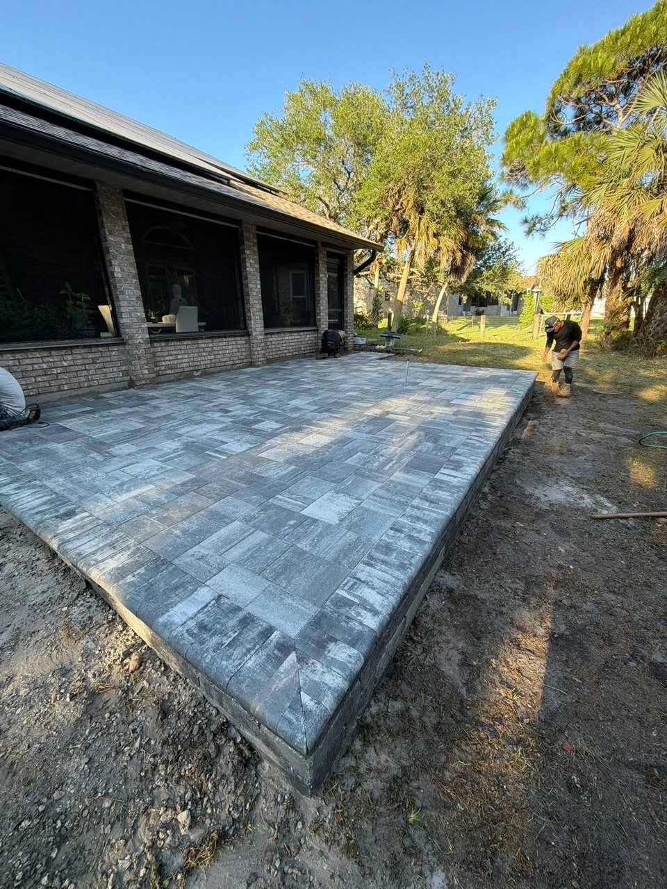 Professional paver installation contractor specializing in driveways, patios, walkways, retaining walls, outdoor kitchens, and fire pits throughout Brevard County, Florida.