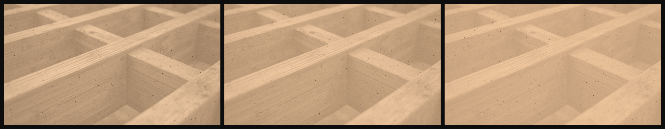 Close-up of unfinished wooden furniture frame with square compartments.