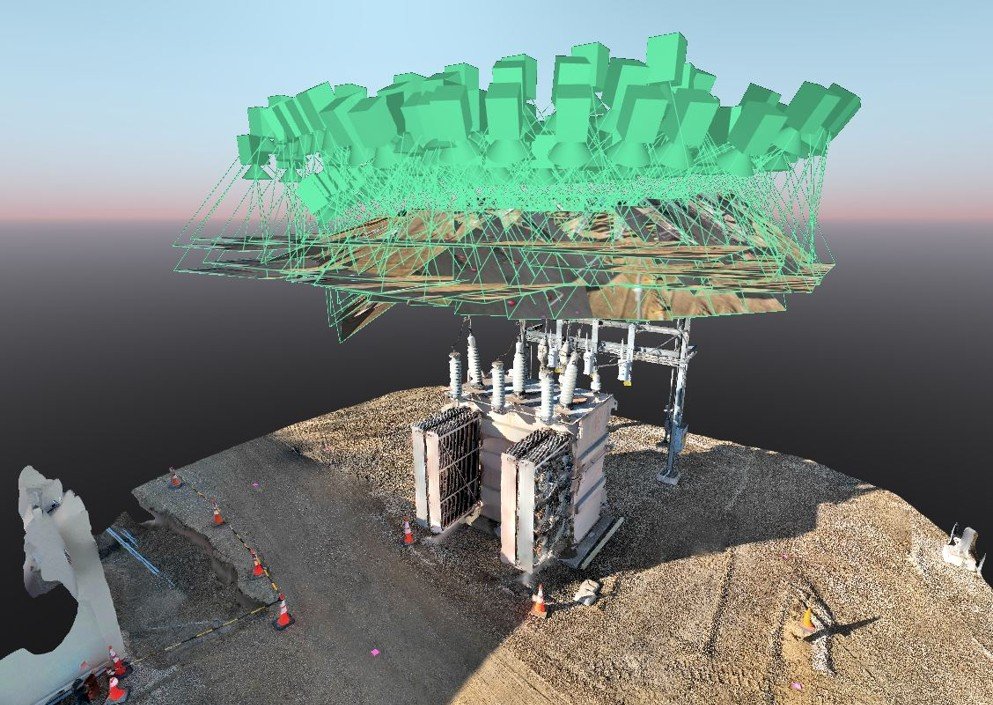 A large infrastructure project involving electrical transformers, underground wiring, and a digital overlay of green 3D blocks and geometric wireframes.