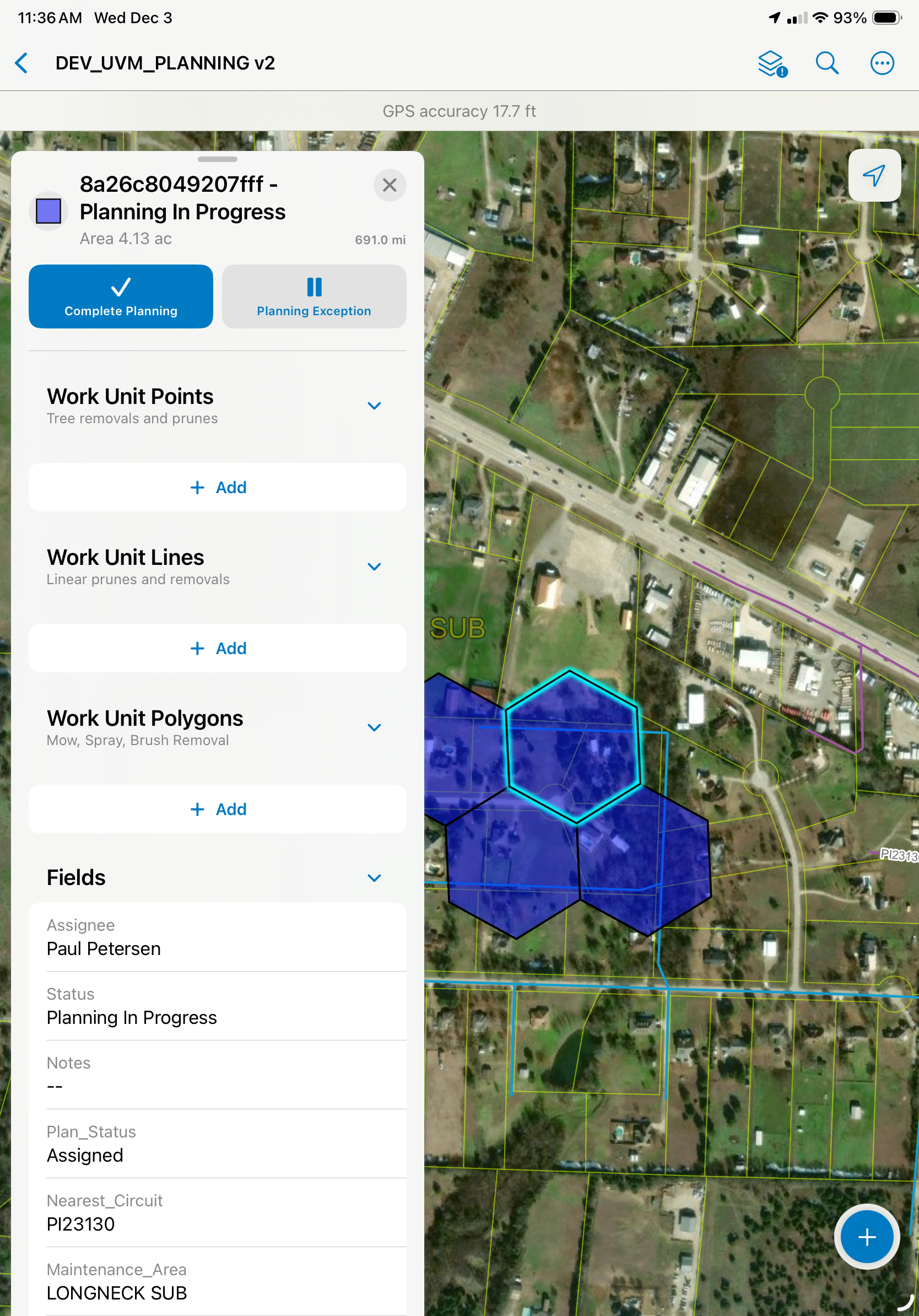 A satellite map showing a planned construction area labeled 'Planning In Progress,' with work unit points, lines, and polygons, including a blue hexagon and other shapes, over a residential neighborhood.