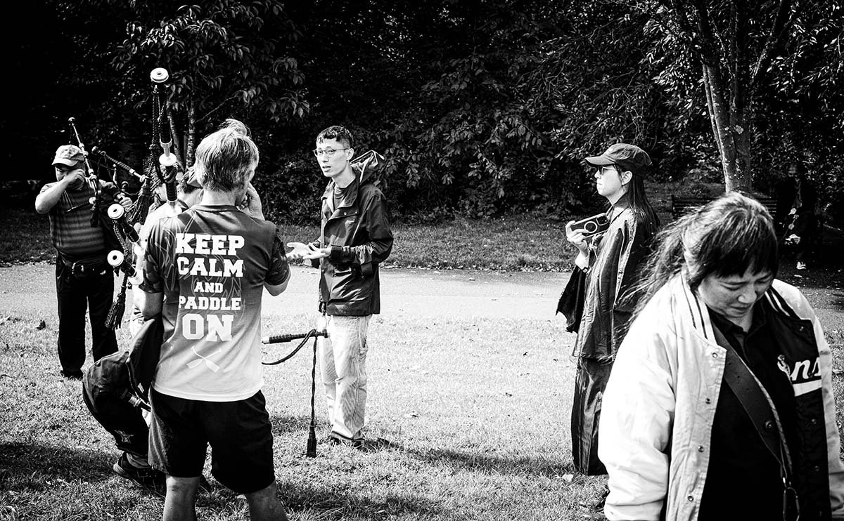 Candid image of a pipe band practicing in Kelvingrove Park, Glasgow. Viewable on the Shutter Scotland 'Glasgow West End Lanes' photo walk.