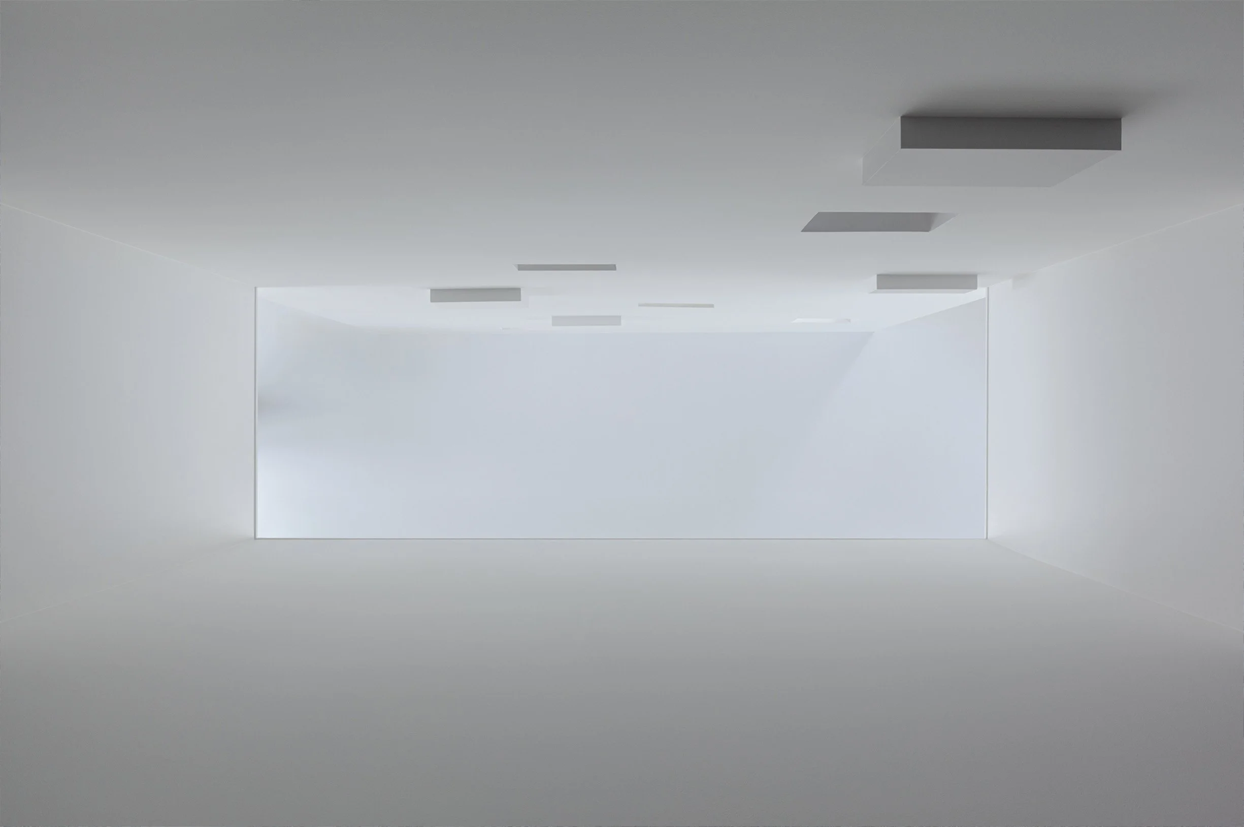 Albers House interior in Scarborough, Toronto, built by Maxamin Homes, minimalist white space with ceiling lights and large open window.