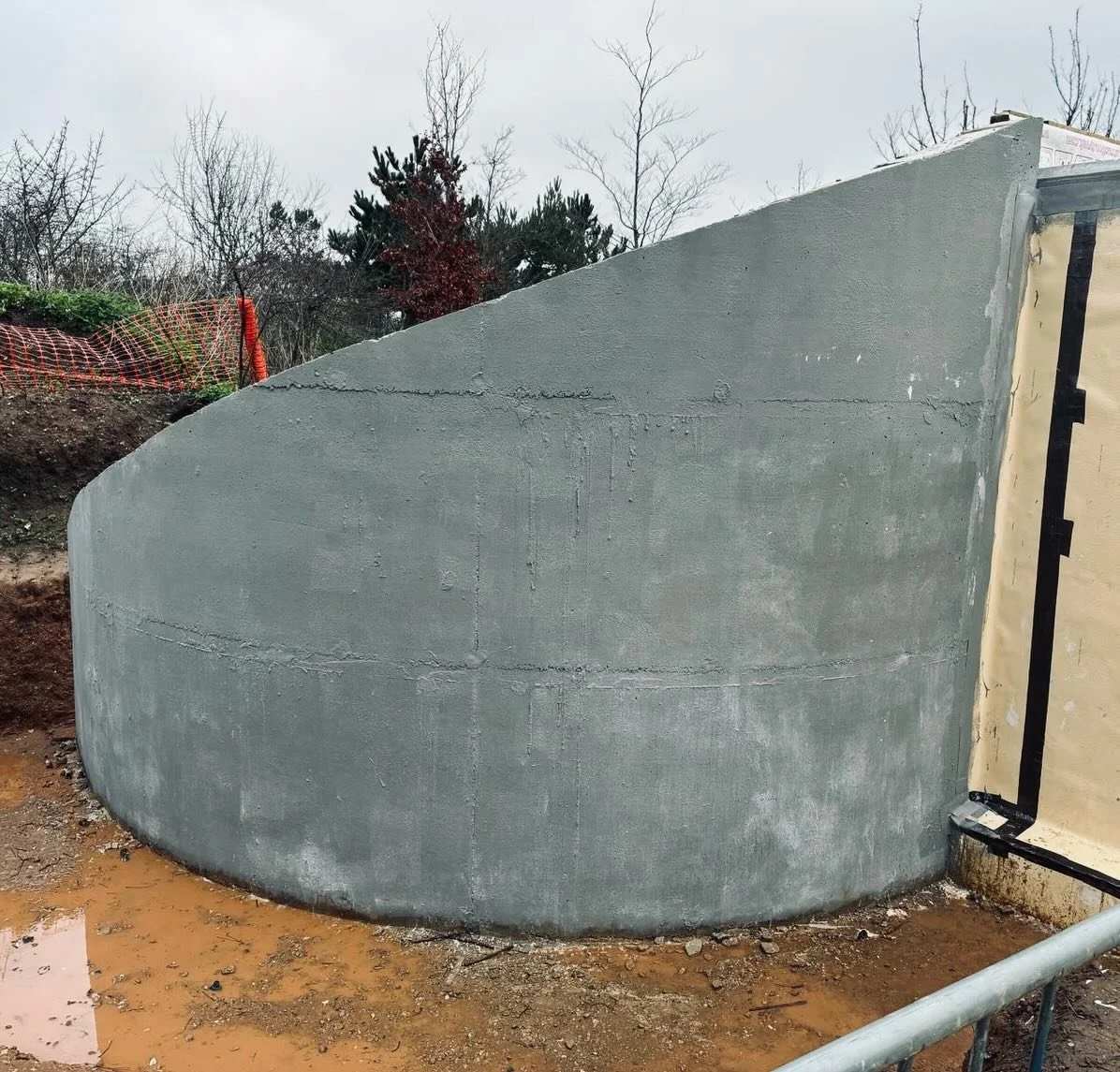 A semi-subterranean tennis pavilion taking shape in Norfolk for a long-term client. This new structure involves extensive engineering, particularly within the rear retaining wall designed to support the surrounding earth and future living roof.  With