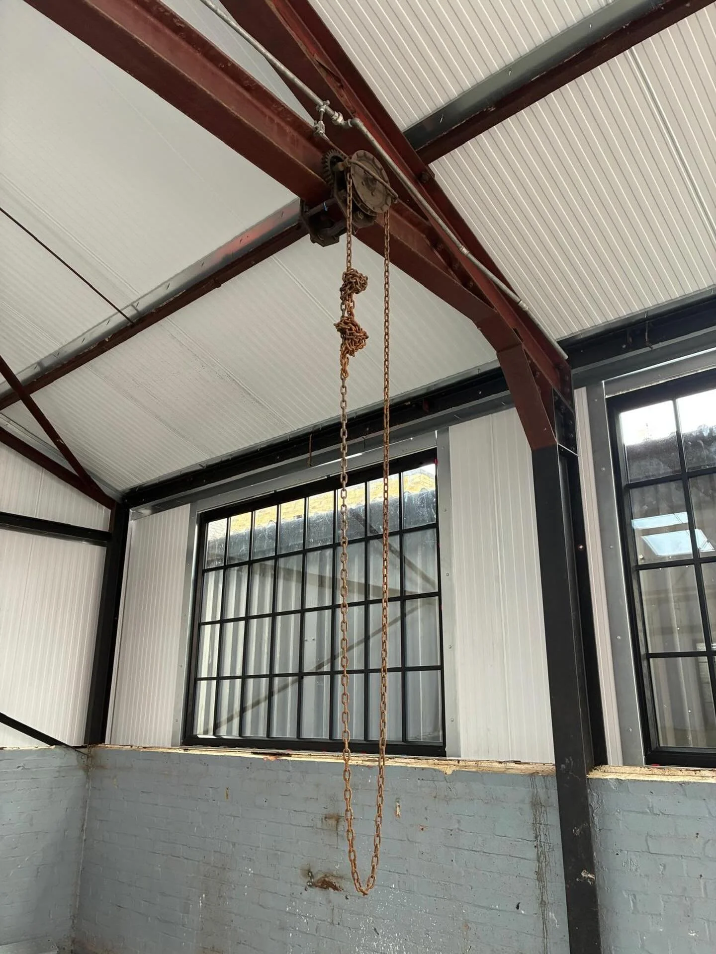This building in west London had good bones and some great original features. But it was a tired site, covered in asbestos sheeting and needed careful management. Stripping structural elements back, removing all cladding and teasing new life into the