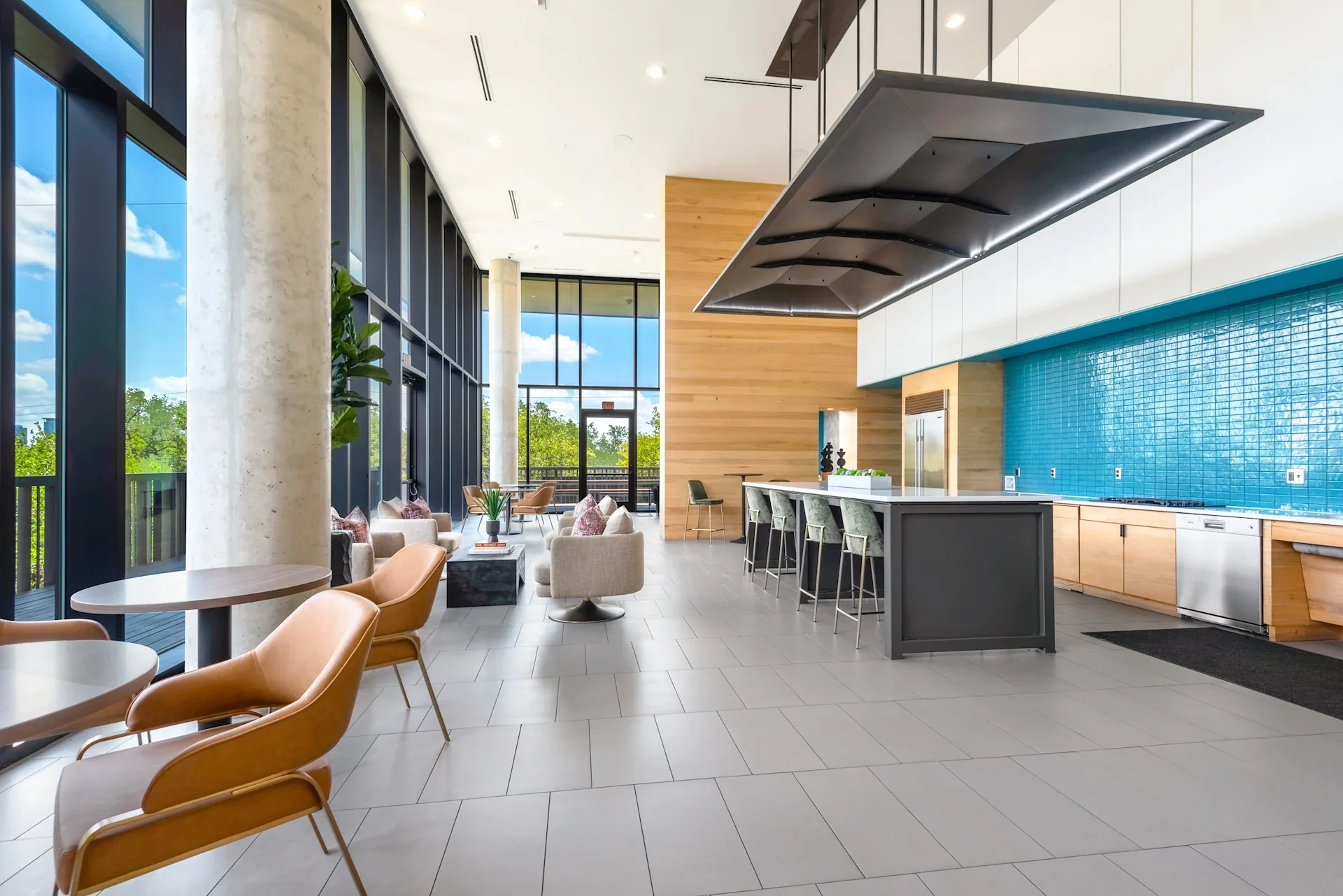 Modern Resident Lounge at Lamar Union With Kitchen, Bar Seating, and Floor-to-Ceiling Windows