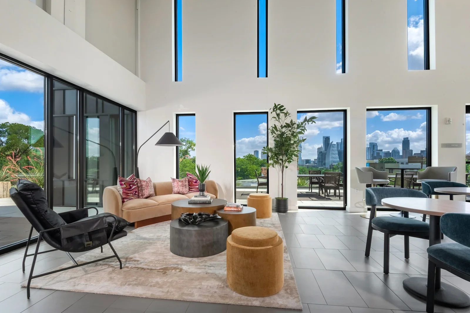 Resident lounge at Lamar Union with skyline views and modern indoor-outdoor seating
