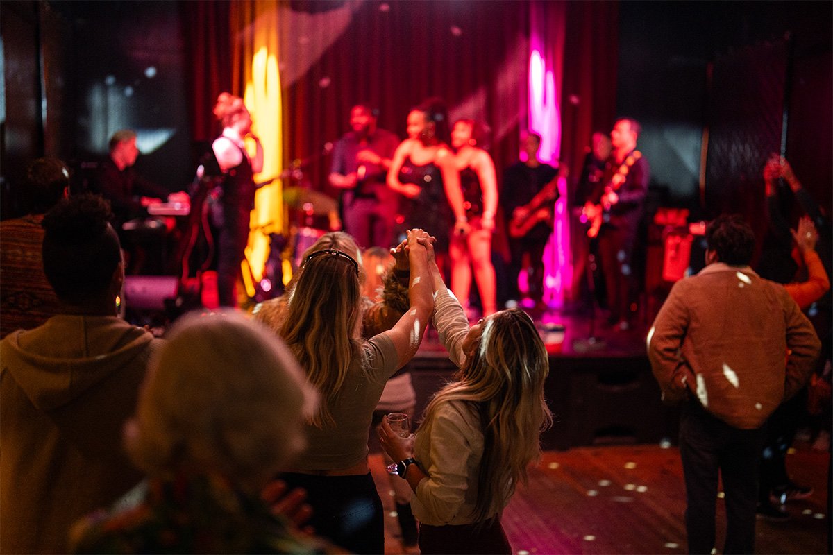 Live Music Event at Lamar Union with Guests Dancing and Enjoying a Band Performing on Stage