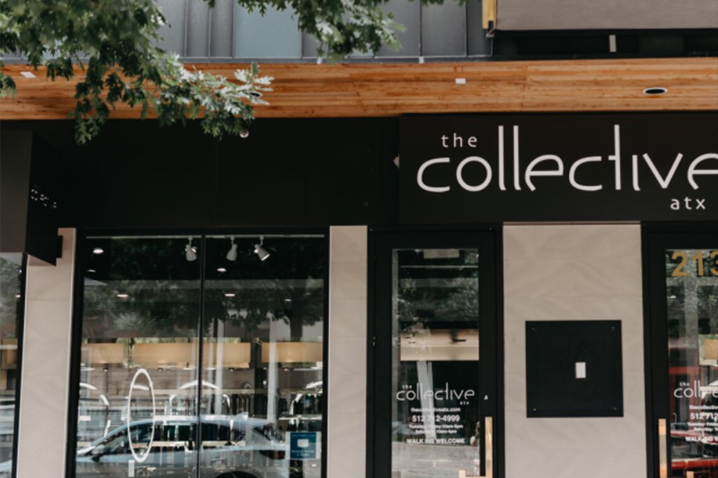 Exterior view of The Collective ATX salon storefront with modern signage and glass doors