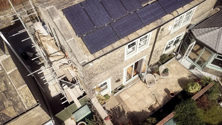 Aerial view of gable-end repointing in progress
