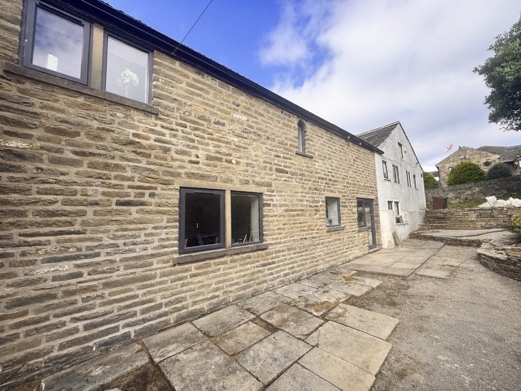 Rear farmhouse stonework after lime repointing