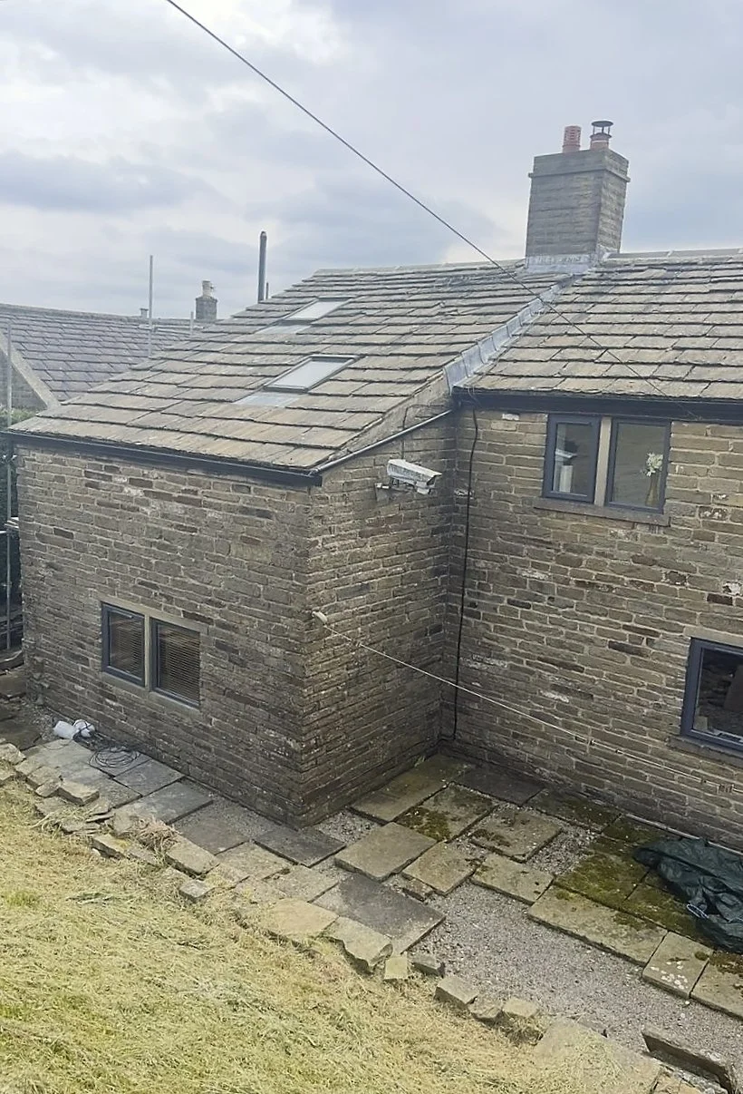 Rear of the farm property before raking out the old mortar joints