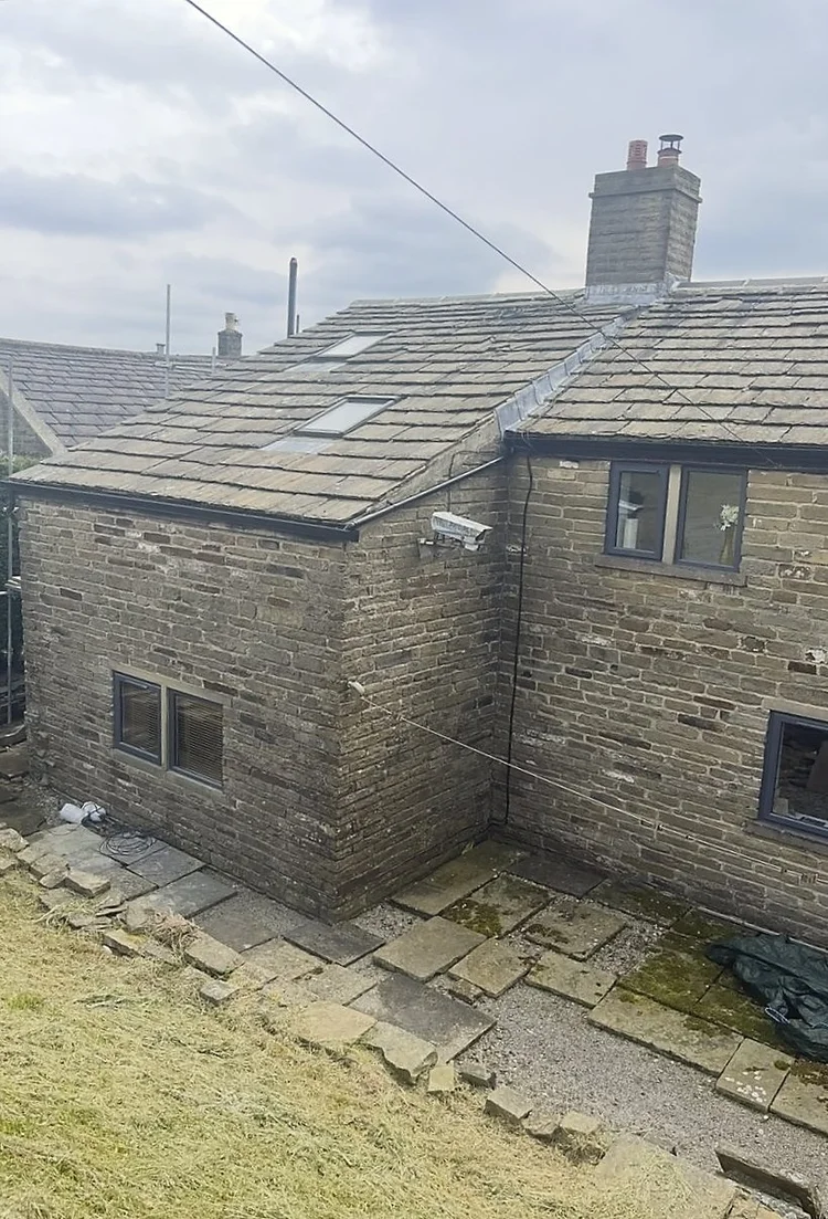 Rear farmhouse elevation before raking out the joints