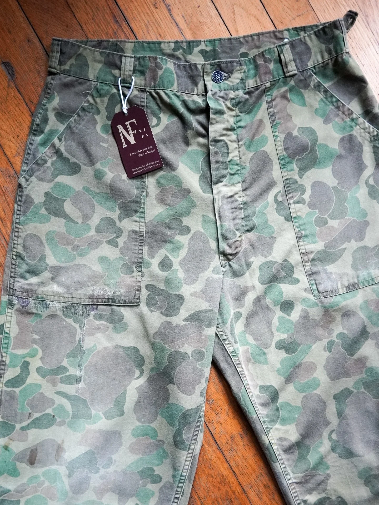 1940s camo duck pants now with 10 new darns. 

These are WWII military issue pants that, judging by the sawdust in the pocket seams and abundant wear and tear, later became shop pants until they were too thrashed to work in anymore. 

They eventually