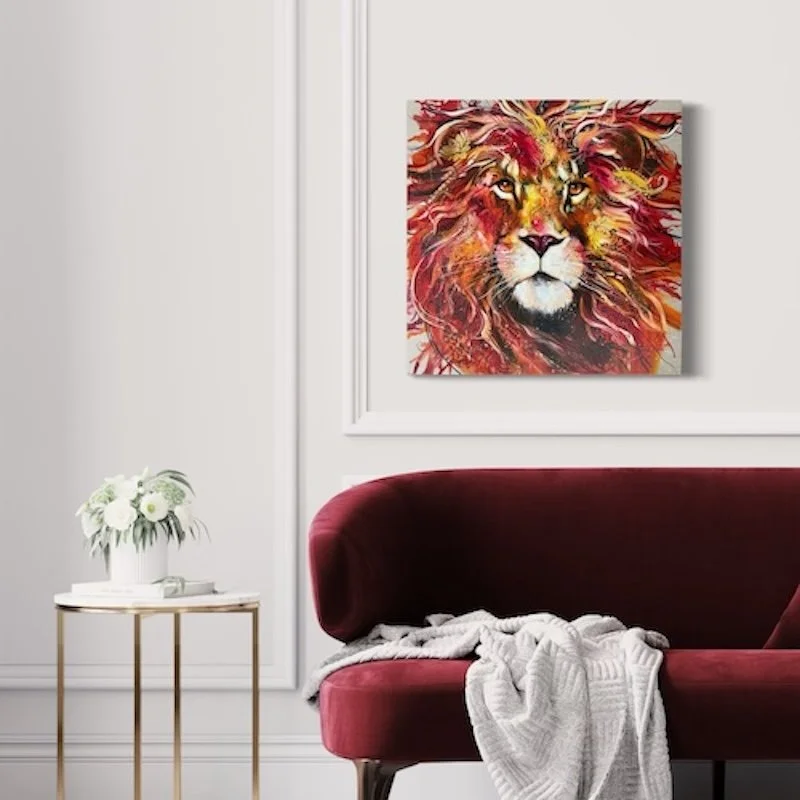 Moto the lion in white room with red sofa.jpeg