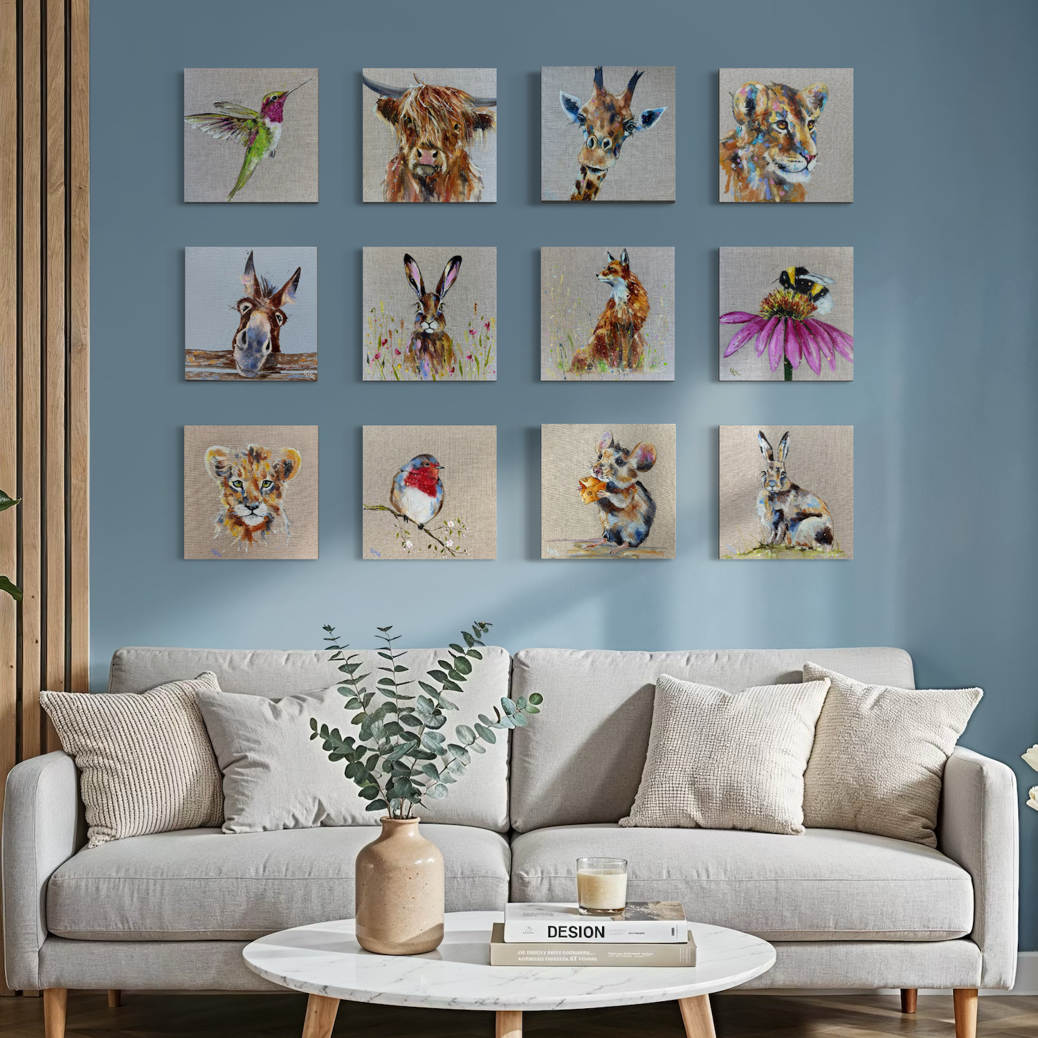 twelve small paintings by Louise Luton in blue room setting.png