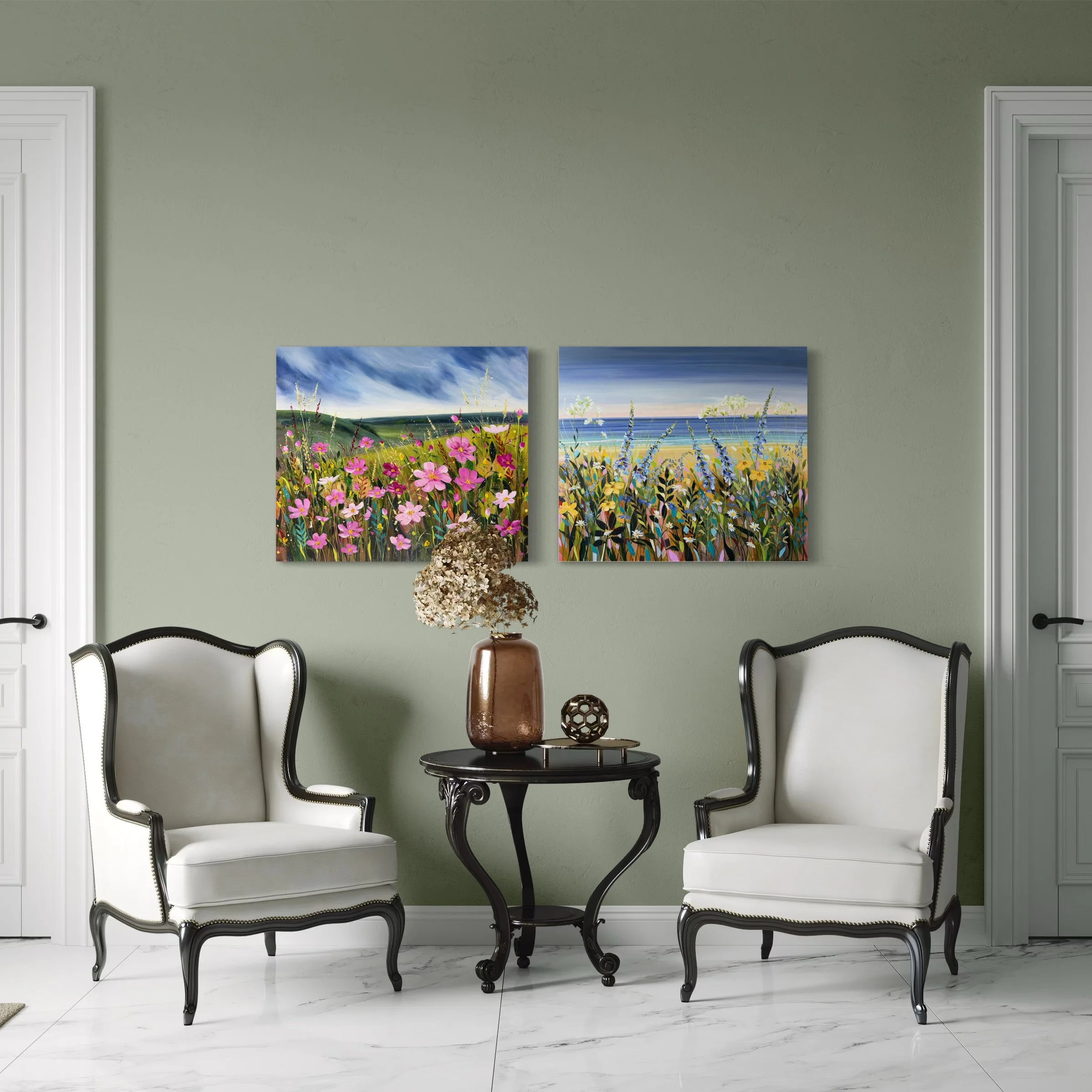 Two floral landscapes in room setting with white chairs.jpeg