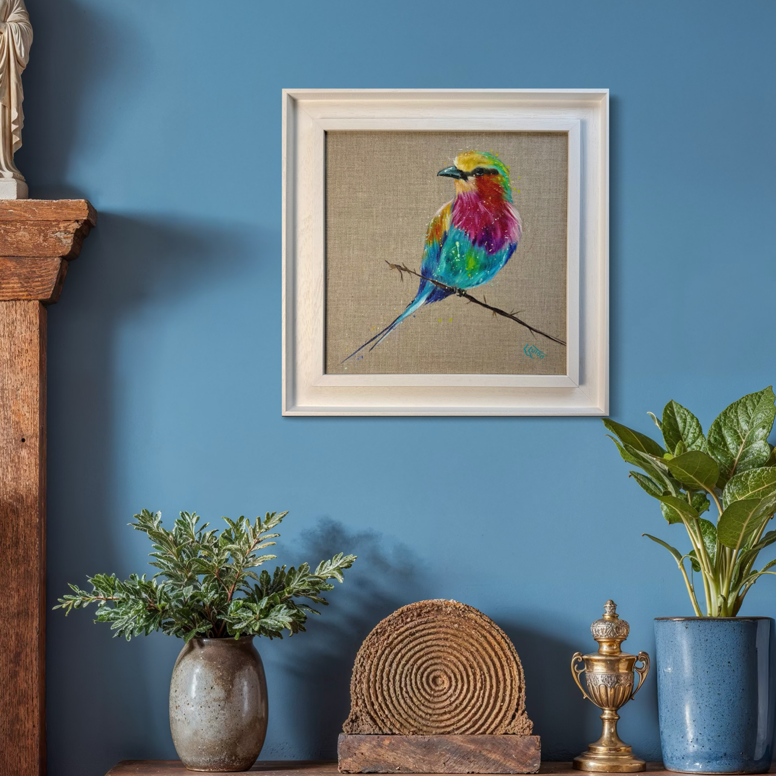 lilac breasted roller in frame in blue room setting.png