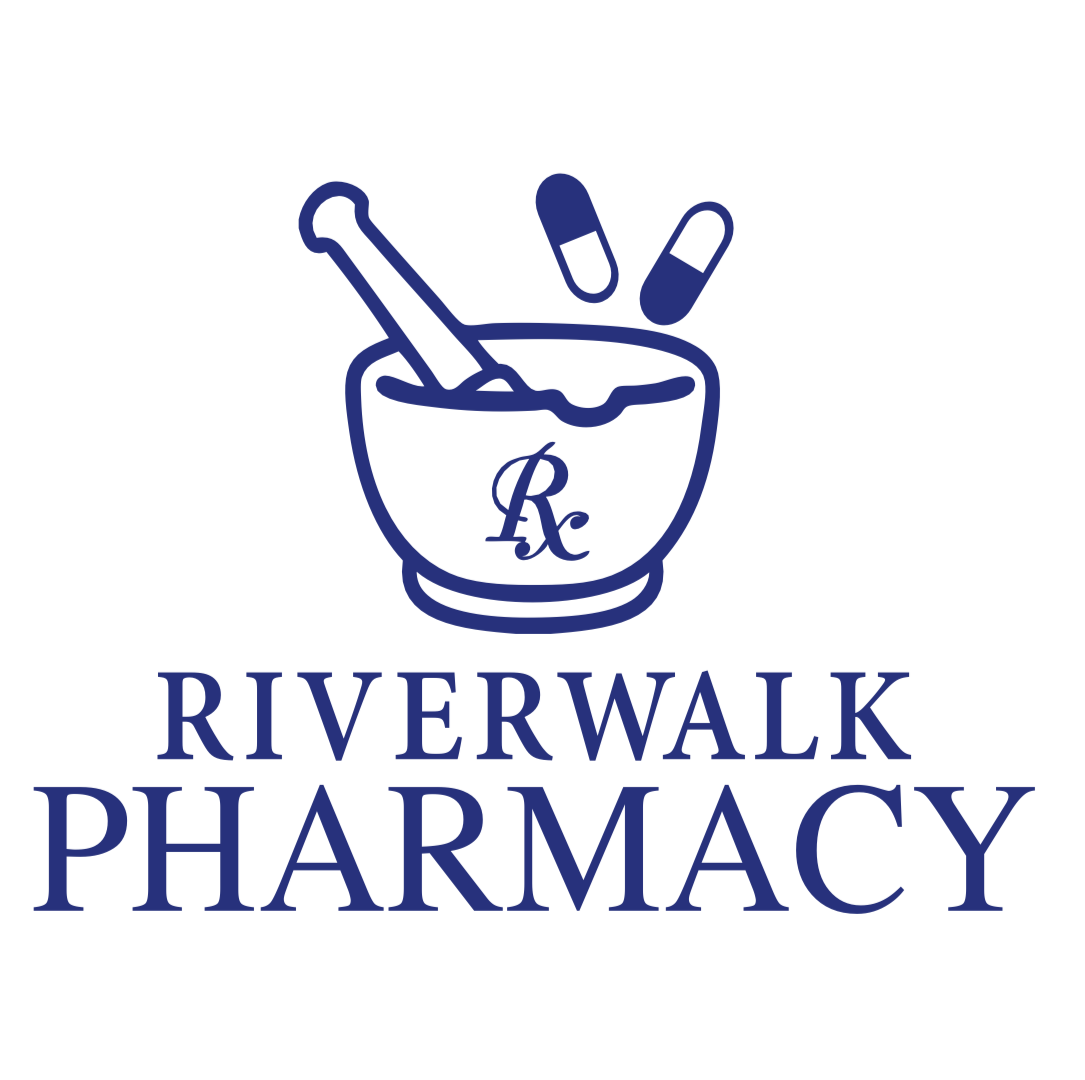 A logo for Riverwalk Pharmacy featuring a mortar and pestle with pills above and a pharmacy symbol. The text 'Riverwalk Pharmacy' is below in bold, capital letters.